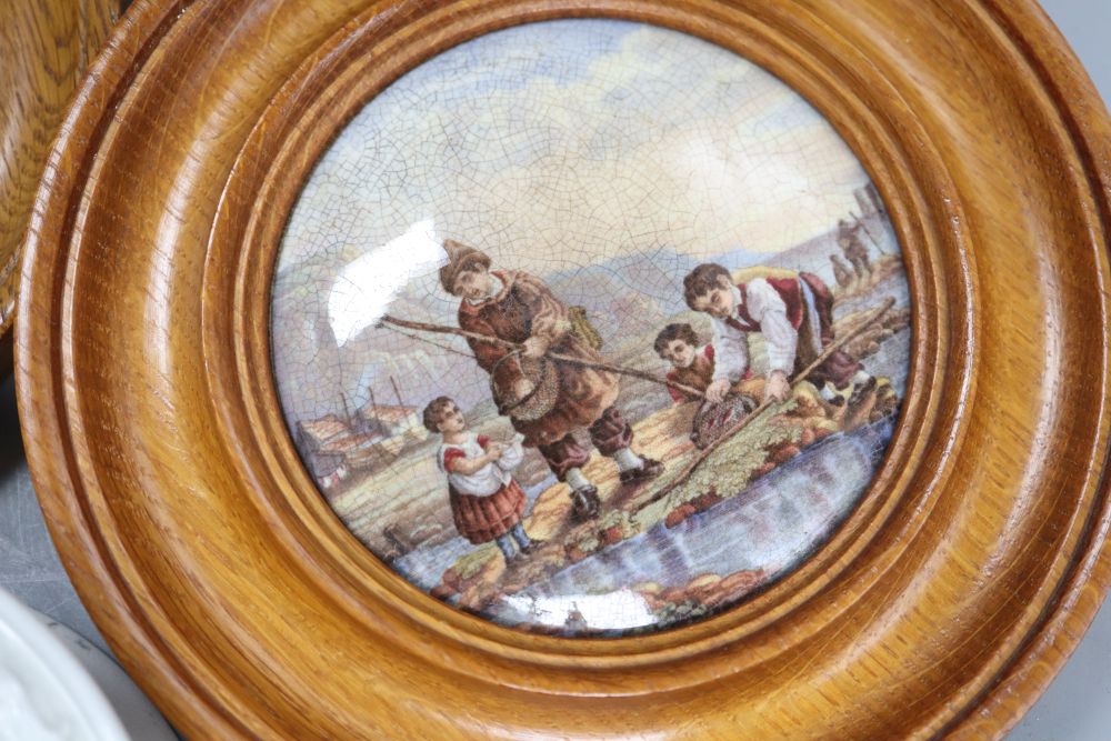 Three Prattware pot lids in oak frames and another Prattware pot